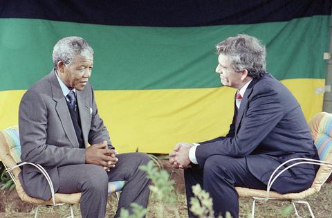 CBS anchorman Dan Rather, right, interviews African National Congress leader Nelson Mandela at Mandela’s home in South Africa on Feb. 14, 1990. The interview was one of the first Mandela gave upon his release on Feb. 11, 1990, after serving 27 years in prison.
              AP Photo/John Parkin