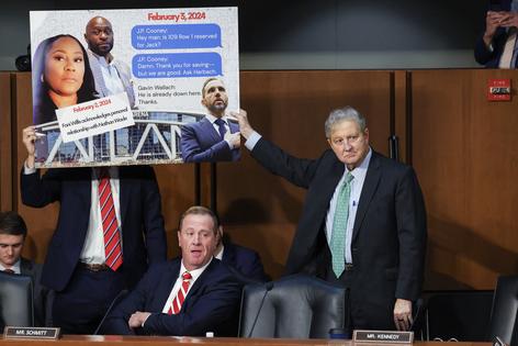 Senate Judiciary Committee member Sen. Eric Schmitt (R-MO) (L) and Sen. John Kennedy (R-LA) display a sign accusing former Special Counsel Jack Smith of meeting with Fulton County, Georgia, District Attorney Fani Willis during a hearing before the Senate Judiciary Committee in the Hart Senate Office Building on Sept. 29, 2026, in Washington, D.C. The committee is holding the hearing to examine Smith’s probe into Donald Trump. (Win McNamee/Getty Images/TCA)