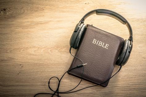 Bible with headphones. Dreamstime/TCA