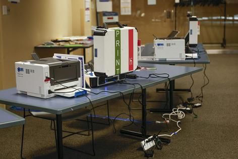 Voting machinery sits at Naperville Municipal Center in Illinois on Sept. 24, 2026, the first day of early voting ahead of the Nov. 3 midterm elections.
              Kamil Krzaczynski/AFP via Getty Images