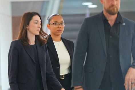 McKenna West, center, walks in a hallway before a court hearing in Dallas on Aug. 25, 2026.
AP Photo/LM Otero