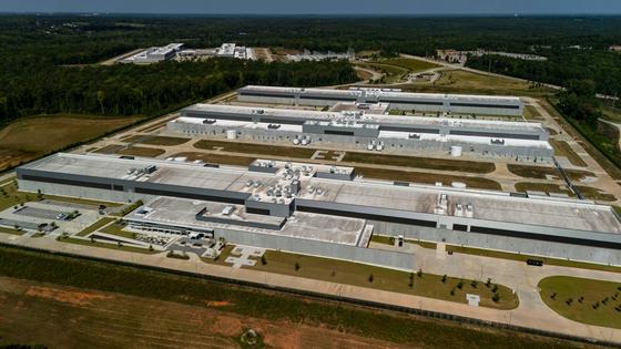 A data center in Georgia is one of many across the U.S. that generate heat from cooling the computer equipment inside.
              AP Photo/Mike Stewart