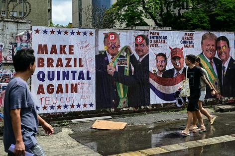 A mural outside a polling place in Sao Paulo shows Donald Trump and Flávio Bolsonaro as a team.
Photo by Pablo Porciuncula/AFP via Getty Images