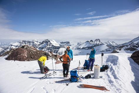 Scientists take measurements on Sperry Glacier, in Glacier National Park, Montana. USGS