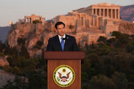 U.S. Secretary of State Marco Rubio speaks at the Pnyx hill, where ancient Athenians held democratic assemblies, with the ancient Parthenon temple atop the Acropolis seen in the background, in Athens on Oct. 7, 2026. (Photo by Mark Schiefelbein / POOL / AFP via Getty Images). POOL/AFP via Getty Images