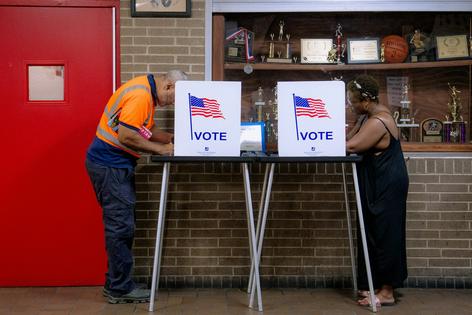 People vote in the primary election at Northwestern High School in Detroit on Aug. 4, 2026.
              AP Photo/Nic Antaya