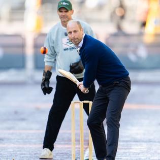 Bang Showbiz / William, Prince of Wales, playing street cricket on The Mall.