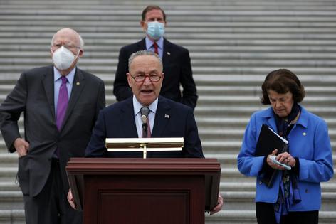 U.S. Sen. Chuck Schumer speaks in front of the U.S. Capitol after a boycott of the Senate Judiciary Committee hearing on the nomination of Judge Amy Coney Barrett to the U.S. Supreme Court on Oct. 22, 2020.
              Alex Wong/Getty Images