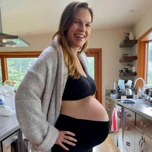 Bang Showbiz / Hilary Swank has revealed she is expecting her third child at 52 - announcing the pregnancy with a glow-in-the-dark family dance featuring her husband and their three-year-old twins and joking her next big project is due for release in December