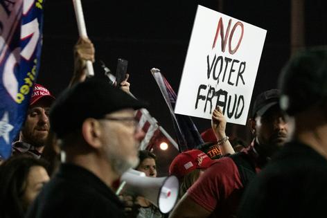 A ‘no voter fraud’ sign is displayed in support of President Donald Trump at the Maricopa County Elections Department office on Nov. 4, 2020, in Phoenix.
Courtney Pedroza/Getty Images