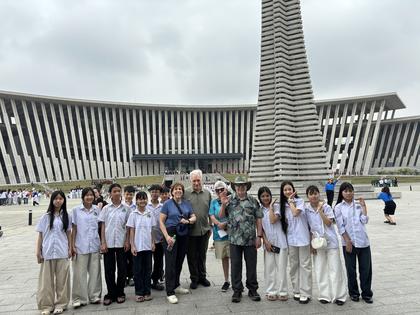 Schoolchildren in Hanoi greet our group at the War Museum. Andy Yemma