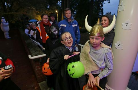 Trick-or-treaters in costume.
              AP Photo/Ted S. Warren