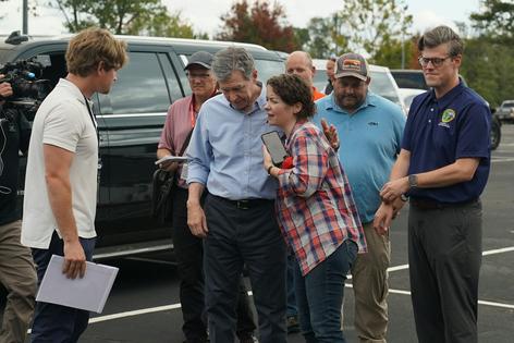 Roy Cooper, center, saw firsthand how disasters can ravage a state, including Hurricane Helene’s flooding that tore through mountain communities of North Carolina in 2024, killing more than 100 people.
              North Carolina Department of Public Service