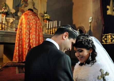 A bride and groom celebrate their wedding in a church in Yerevan, Armenia, in 2014.
Karen Minasyan/AFP via Getty Images