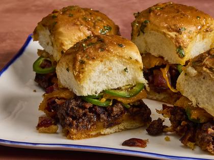 These cheesy barbecue sliders with ground beef and crispy bacon are a game-day favorite. (Erik Bernstein/TCA)