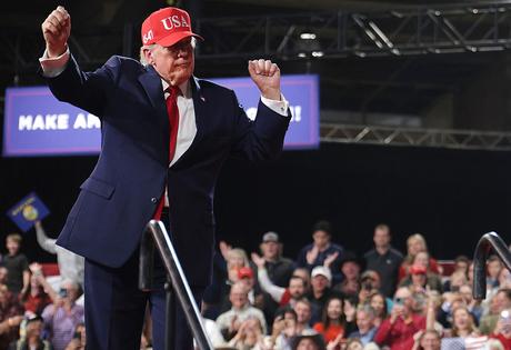 KALISPELL, MONTANA - OCTOBER 14: U.S. President Donald Trump dances as he walks offstage during an election rally at Majestic Valley Arena on October 14, 2026 in Kalispell, Montana. President Trump traveled to Arizona and Montana today to campaign for Republican candidates ahead of the midterm elections. (Photo by Alex Wong/Getty Images)