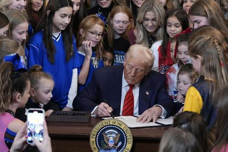 President Donald Trump signs an executive order barring transgender female athletes from competing in women’s or girls’ sporting events, on Feb. 5, 2025.
AP Photo/Alex Brandon