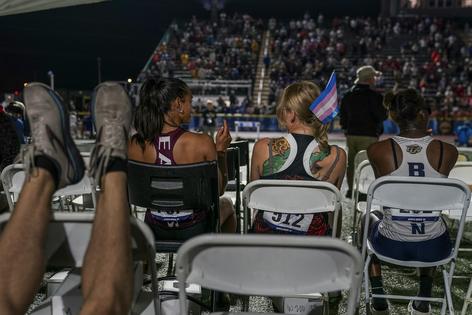 Bans on transgender athletes like sprinter Sadie Schreiner, center, are often framed as protecting women. Photo by Jahi Chikwendiu/The Washington Post via Getty Images