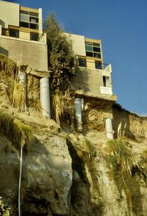 The piers beneath these buildings on the cliff at Capitola, Calif., had little left to stand on after erosion from fierce El Niño-fueled storms.
              Gary Griggs