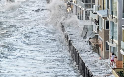 Pacific Ocean waves generated by Hurricane Marie crash over a seawall protecting homes in Long Beach, Calif., on Sept. 7, 2026. El Nino’s warm water was already fueling powerful storms in the Pacific.
              Mario Tama/Getty Images