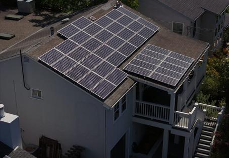 Solar panels have become far cheaper than physicist Amory Lovins anticipated, letting him and others generate electricity affordably on their own rooftops. Justin Sullivan/Getty Images