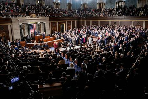Republican members of Congress stand while Democrats keep their seats during President Donald Trump's State of the Union address at the U.S. Capitol on Feb. 24, 2026.  Alex Brandon/AP
