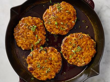Salmon patties are packed with flavor, thanks to orange, harissa paste and honey. (Alex Lepe/TCA)