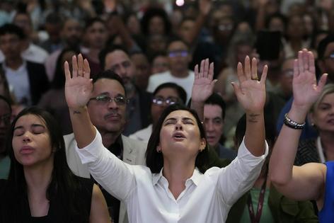 Brazil’s former first lady Michelle Bolsonaro prays for her husband, Jair Bolsonaro, at an evangelical church on the outskirts of Brasilia, Brazil, on July 24, 2025.
AP Photo/Eraldo Peres