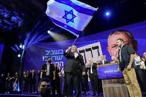 Former Israeli military chief and Yashar party leader Gadi Eisenkot waves an Israeli flag as he addresses supporters on Oct. 28, 2026.
              Tomer Neuberg/Middle East Images/AFP via Getty Images