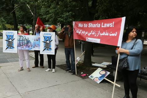 Protesters in Toronto, Canada, call for an end to Sharia law in Iran, on Sept. 20, 2018.
              Creative Touch Imaging Ltd./NurPhoto via Getty Images