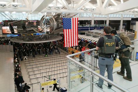Immigration and Customs Enforcement agents patrol Terminal 1 at John F. Kennedy International Airport in New York on March 27, 2026.
              Michael M. Santiago/Getty Images