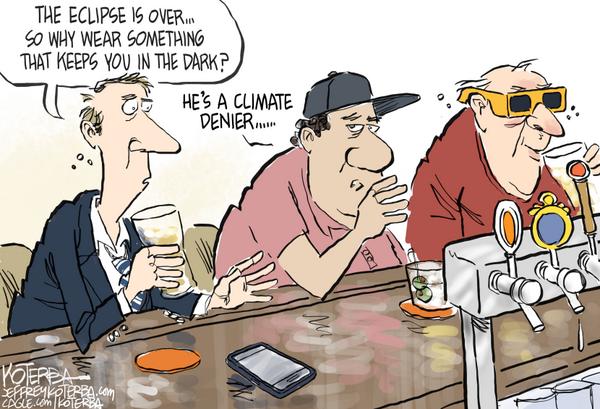 Climate Denier Wears Eclipse Glasses