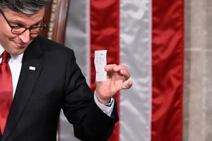 US House Speaker Mike Johnson shows the final tally of the vote on US President Donald Trump's tax bill on the floor of the House of Representatives at the US Capitol in Washington, D.C., on July 3, 2025. Congress passed the 