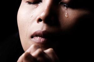 Woman praying. Dreamstime/TCA