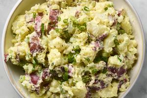Make this easy potluck side dish with smashed red potatoes, crunchy celery, and creamy mayo. (Alex Lepe/TCA)