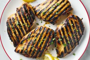 Learn key steps to really juicy grilled chicken, from pounding the chicken, making a marinade, and achieving great grill marks. (Alex Lepe/TCA)