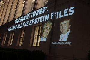 An image of U.S. President Donald Trump and Jeffrey Epstein, along with the words “President Trump: Release All the Epstein Files,