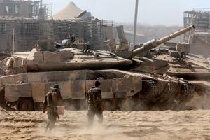 Israeli troops deploy by Israel's border fence with the Gaza Strip on July 10, 2025, amid the ongoing war with the Palestinian militant movement Hamas. (Jack Guez/AFP/Getty Images/TNS)