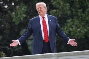U.S. President Donald Trump gestures while answering questions from reporters as he tours the roof of the West Wing of the White House on Aug. 5, 2025, in Washington, D.C.  (Photo by Win McNamee/Getty Images)