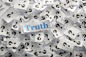 Truth on question marks on white papers -hard light. Dreamstime/TCA