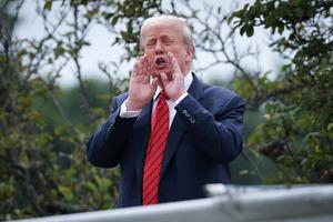 WASHINGTON, DC - AUGUST 05: U.S. President Donald Trump shouts answers to questions from reporters as he tours the roof of the West Wing of the White House on August 05, 2025 in Washington, DC. Trump has undertaken several renovation projects at the White House to include the construction of a concrete patio at the Rose Garden. (Photo by Win McNamee/Getty Images)