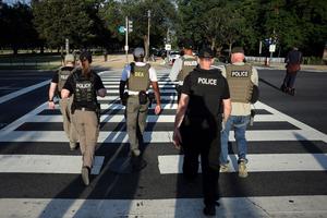 Federal law enforcement officers patrol on the National Mall on Aug. 12, 2025, in Washington, D.C. (Win McNamee/Getty Images/TNS)
