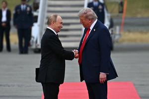 TOPSHOT - US President Donald Trump (R) greets Russian President Vladimir Putin on the tarmac after they arrived at Joint Base Elmendorf-Richardson in Anchorage, Alaska, on August 15, 2025. Putin is in Alaska at the invitation of Trump in his first visit to a Western country since he ordered the 2022 invasion of Ukraine that has killed tens of thousands of people. (Photo by ANDREW CABALLERO-REYNOLDS / AFP) (Photo by ANDREW CABALLERO-REYNOLDS/AFP via Getty Images)
