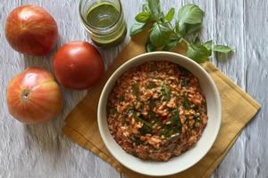 The risotto benefits from a homemade basil oil condiment and a shower of Parmesan. (JeanMarie Brownson/TCA)