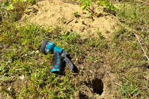 This is just one entrance/exit to a large chipmunk den in my yard. Notice the huge pile of dirt the critters brought to the surface. (Tim Carter/Tribune Content Agency). TNS