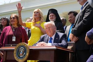 WASHINGTON, DC - MAY 01: Head of the White House Faith Office Paula White sings as she stands next to U.S. President Donald Trump and other religious leaders during a National Day of Prayer event in the Rose Garden at the White House on May 1, 2025 in Washington, DC. The National Day of Prayer is a congressionally recognized observance that calls on people of all faiths to participate in a day of prayer and reflection. (Photo by Andrew Harnik/Getty Images)