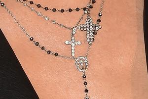 Cross around neck. Getty Images