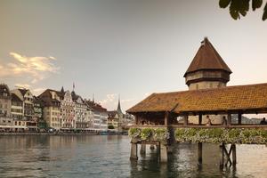 Covered and filled with paintings, Lucerne’s Chapel Bridge zigzags its way across the Reuss River. (Dominic Arizona Bonuccelli, Rick Steves’ Europe)
