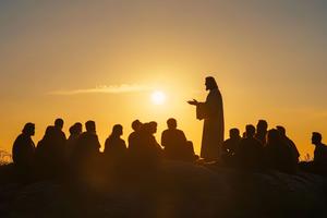 Silhouette of Jesus delivering a sermon on a mountaintop, a biblical gospel teaching scene, Generated by AI. Dreamstime/TCA