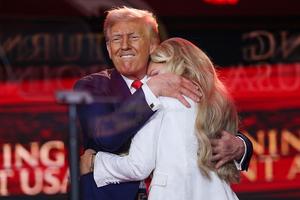 GLENDALE, ARIZONA - SEPTEMBER 21:  Erika Kirk joins U.S. President Donald Trump onstage during the memorial service for political activist Charlie Kirk at State Farm Stadium on September 21, 2025 in Glendale, Arizona. Kirk, the CEO and co-founder of Turning Point USA, was shot and killed on September 10th while speaking at an event during his 